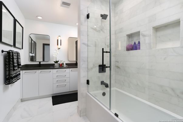 Bathroom, Dual Sink Vanities, Glass Shower, Interior, Marble, Marble Walls, Recessed Lighting