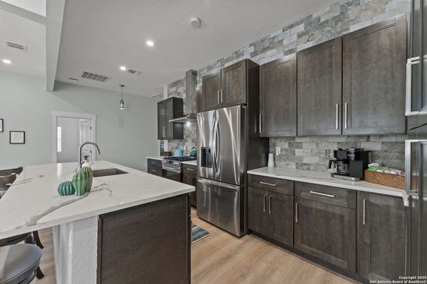 Interior, Kitchen, Pendant Lights, Recessed Lighting, Stainless Steel Appliances, Stone Walls, Wood Texture Flooring