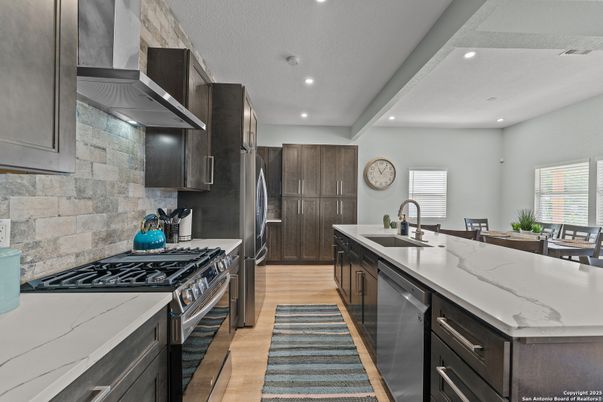 Interior, Kitchen, Recessed Lighting, Stainless Steel Appliances, Stone Walls, Wood Texture Flooring