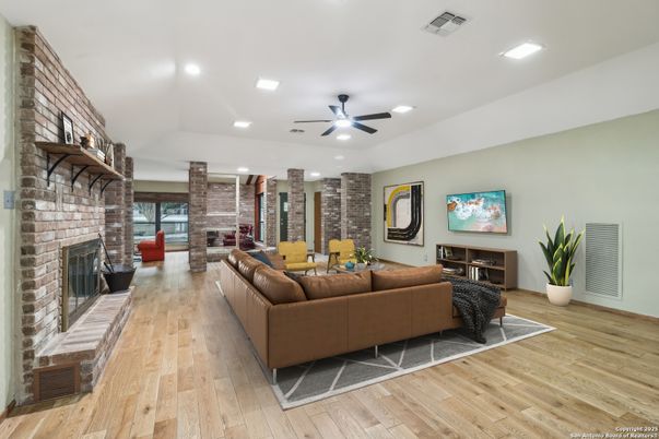 Fireplace, Interior, Living room, Recessed Lighting, Stone Walls, Wood Texture Flooring