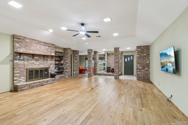 Fireplace, Interior, Recessed Lighting, Stone Walls, Wood Texture Flooring