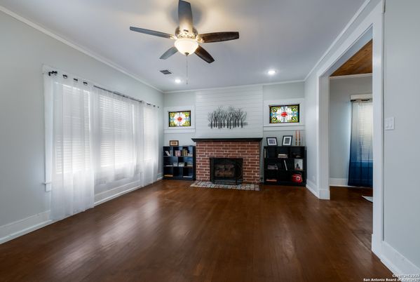 Empty room, Fireplace, Interior, Recessed Lighting, Stone Walls, Wood Texture Flooring