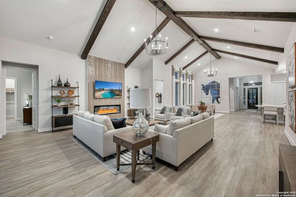 Chandelier, Dining room, Fireplace, Interior, Living room, Pendant Lights, Recessed Lighting, Stone Walls, Wooden Beams, Wood Texture Flooring