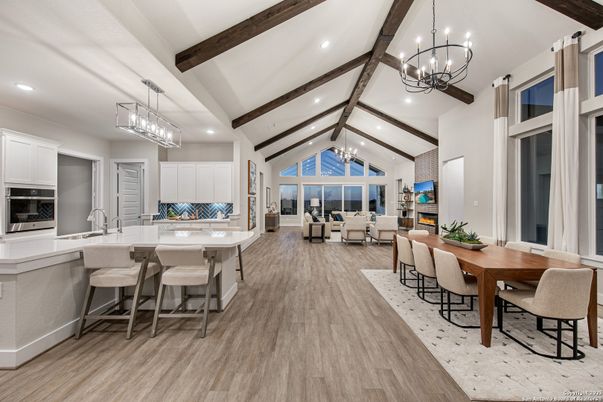 Chandelier, Dining room, Fireplace, Interior, Kitchen, Living room, Pendant Lights, Recessed Lighting, Stainless Steel Appliances, Wooden Beams, Wood Texture Flooring