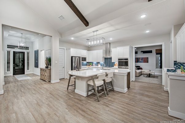 Chandelier, Interior, Kitchen, Living room, Pendant Lights, Recessed Lighting, Stainless Steel Appliances, Wooden Beams, Wood Texture Flooring