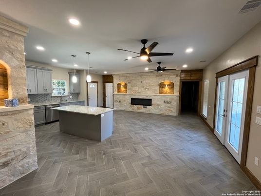 Fireplace, Interior, Kitchen, Pendant Lights, Recessed Lighting, Stone Walls, Wood Texture Flooring