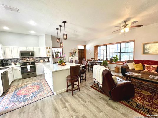 Dining room, Interior, Kitchen, Living room, Pendant Lights, Recessed Lighting, Stainless Steel Appliances, Wood Texture Flooring