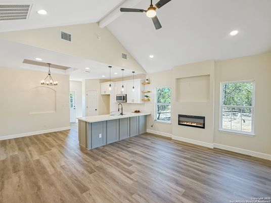 Empty room, Fireplace, Interior, Kitchen, Pendant Lights, Recessed Lighting, Wood Texture Flooring