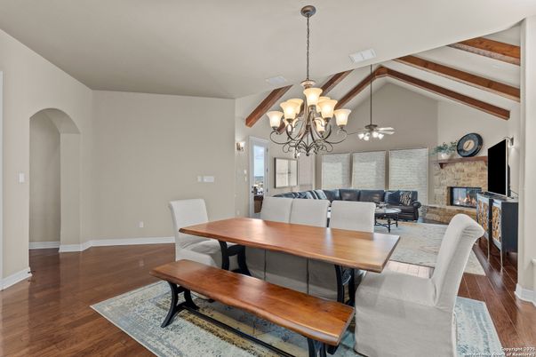 Chandelier, Dining room, Fireplace, Interior, Living room, Stone Walls, Wooden Beams, Wood Texture Flooring