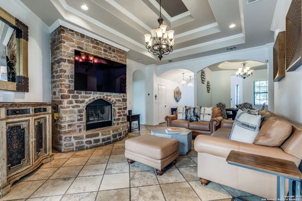 Chandelier, Fireplace, Interior, Living room, Recessed Lighting, Stone Walls