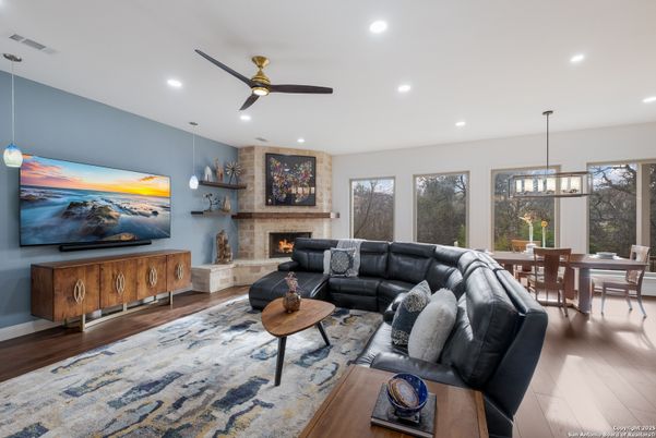 Dining room, Fireplace, Interior, Living room, Pendant Lights, Recessed Lighting, Wood Texture Flooring