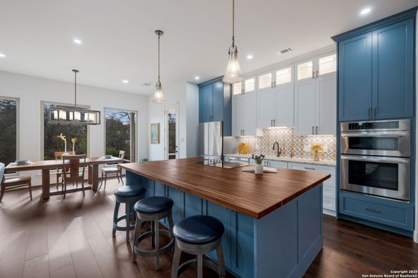 Dining room, Interior, Kitchen, Pendant Lights, Recessed Lighting, Stainless Steel Appliances, Wood Texture Flooring