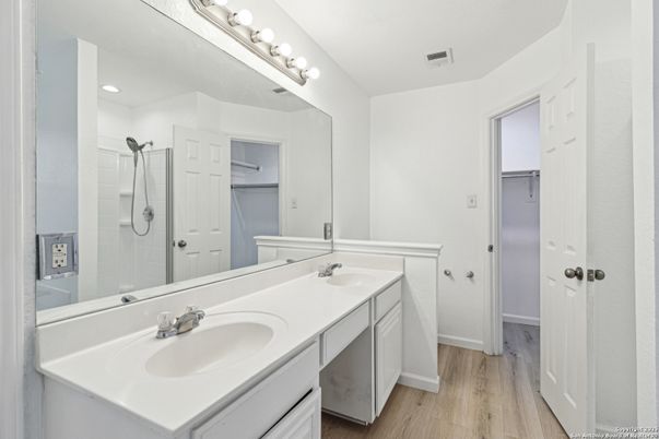 Bathroom, Dual Sink Vanities, Interior, Recessed Lighting, Wood Texture Flooring