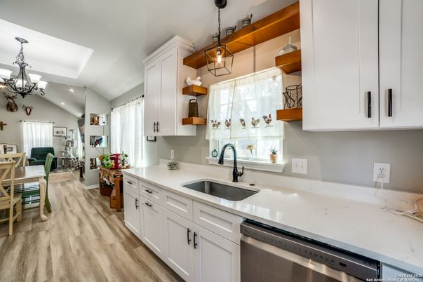 Chandelier, Dining room, Interior, Kitchen, Pendant Lights, Recessed Lighting, Stainless Steel Appliances, Wood Texture Flooring