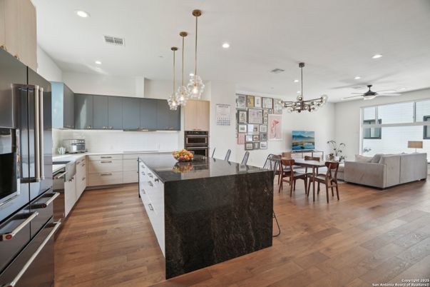 Dining room, Interior, Kitchen, Living room, Pendant Lights, Recessed Lighting, Stainless Steel Appliances, Wood Texture Flooring