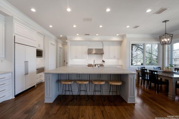 Dining room, Interior, Kitchen, Pendant Lights, Recessed Lighting, Stainless Steel Appliances, Wood Texture Flooring