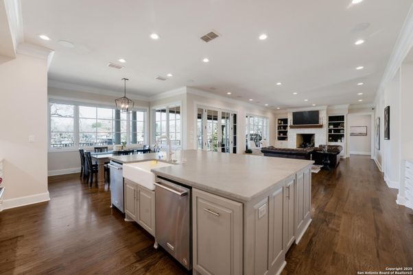 Dining room, Fireplace, Interior, Kitchen, Living room, Pendant Lights, Recessed Lighting, Stainless Steel Appliances, Wood Texture Flooring