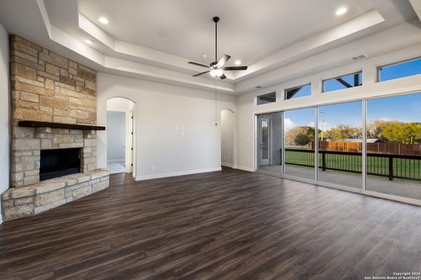 Empty room, Fireplace, Interior, Recessed Lighting, Stone Walls, Wood Texture Flooring