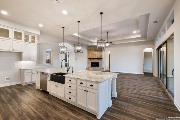 Fireplace, Interior, Kitchen, Pendant Lights, Recessed Lighting, Stainless Steel Appliances, Wood Texture Flooring
