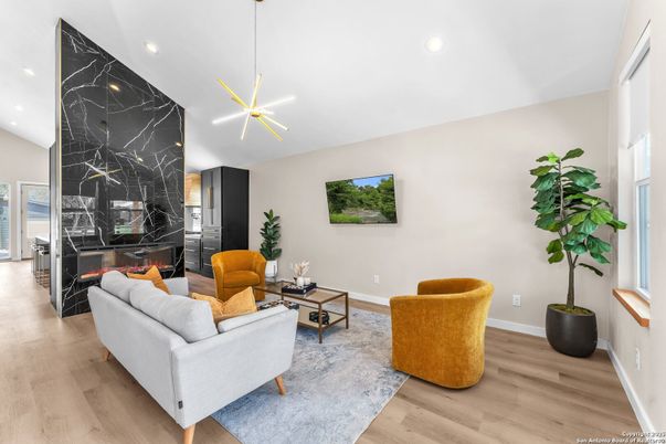 Fireplace, Interior, Living room, Marble Walls, Pendant Lights, Recessed Lighting, Wood Texture Flooring