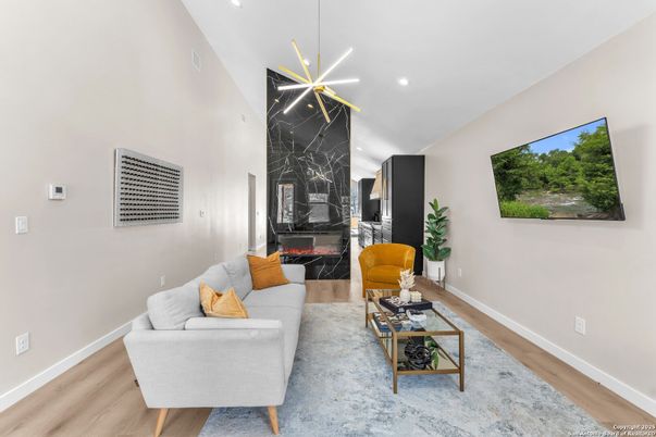Fireplace, Interior, Living room, Marble Walls, Pendant Lights, Recessed Lighting, Wood Texture Flooring