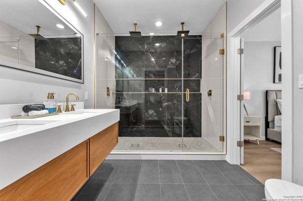 Bathroom, Dual Sink Vanities, Glass Shower, Interior, Marble Walls, Recessed Lighting
