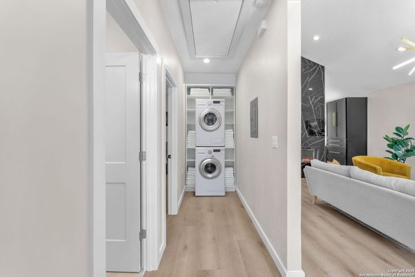 Interior, Marble Walls, Recessed Lighting, Utility Closets, Washer, Wood Texture Flooring