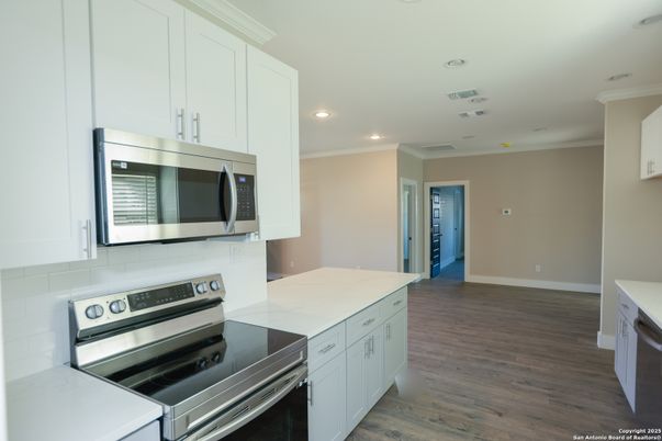 Interior, Kitchen, Recessed Lighting, Stainless Steel Appliances, Wood Texture Flooring