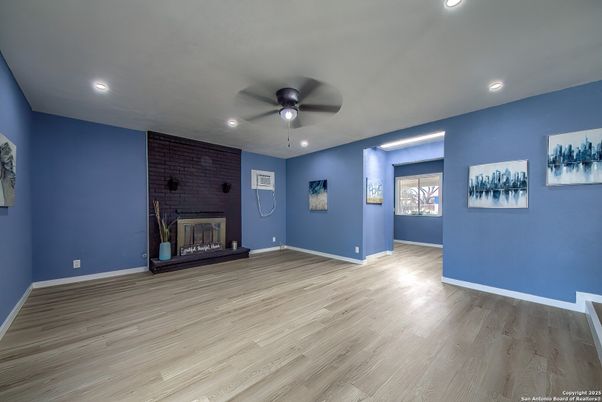 Empty room, Fireplace, Interior, Recessed Lighting, Stone Walls, Wood Texture Flooring