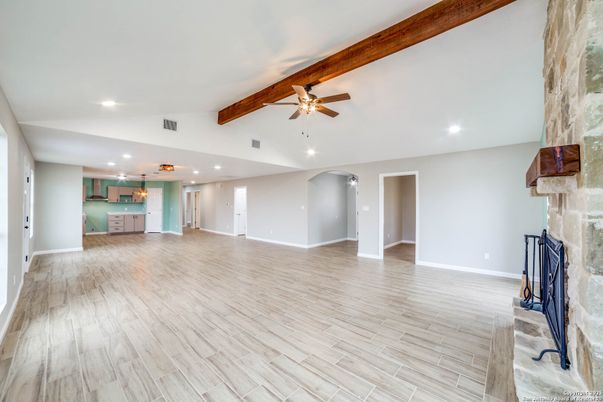 Empty room, Fireplace, Interior, Recessed Lighting, Wooden Beams, Wood Texture Flooring