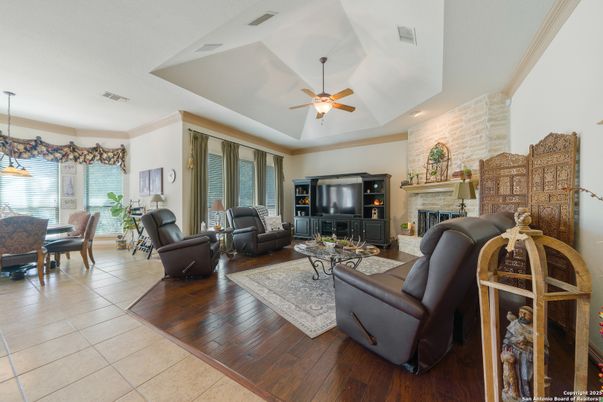 Dining room, Fireplace, Interior, Living room, Pendant Lights, Recessed Lighting, Stone Walls, Wood Texture Flooring