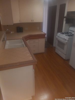 Interior, Kitchen, Tile Countertops, Wood Texture Flooring