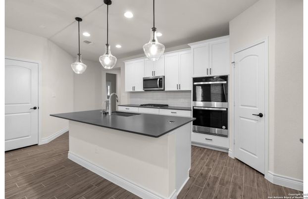 Interior, Kitchen, Pendant Lights, Recessed Lighting, Stainless Steel Appliances, Wood Texture Flooring