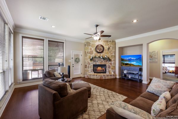 Fireplace, Interior, Living room, Recessed Lighting, Stone Walls, Wood Texture Flooring