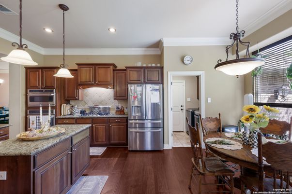 Dining room, Interior, Kitchen, Pendant Lights, Recessed Lighting, Stainless Steel Appliances, Wood Texture Flooring