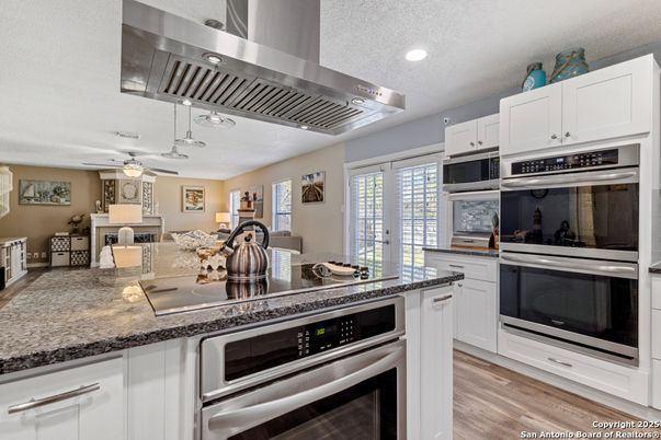 Dining room, Interior, Kitchen, Recessed Lighting, Stainless Steel Appliances, Wood Texture Flooring