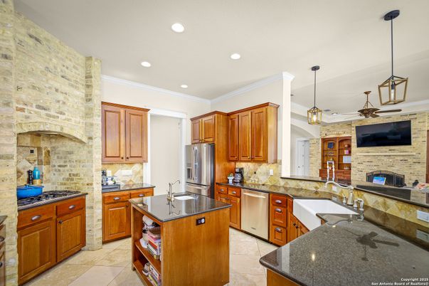 Fireplace, Interior, Kitchen, Pendant Lights, Recessed Lighting, Stainless Steel Appliances, Stone Walls