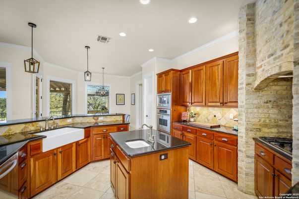 Interior, Kitchen, Pendant Lights, Recessed Lighting, Stainless Steel Appliances, Stone Walls