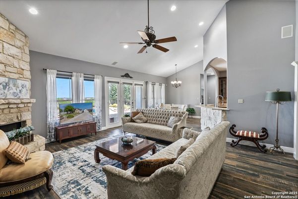 Chandelier, Dining room, Fireplace, Interior, Living room, Recessed Lighting, Stone Walls, Wood Texture Flooring