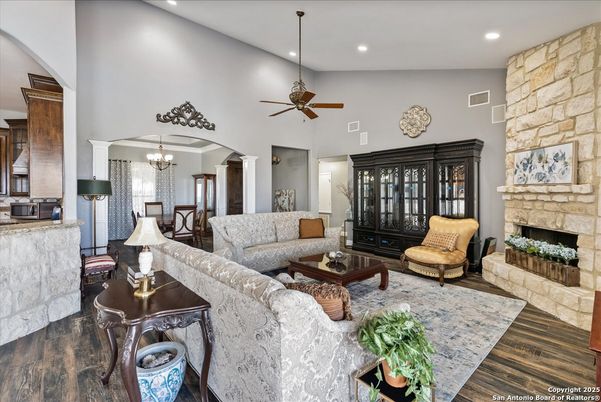 Chandelier, Dining room, Fireplace, Interior, Living room, Recessed Lighting, Stone Walls, Wood Texture Flooring