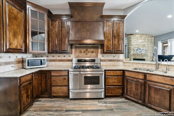 Interior, Kitchen, Recessed Lighting, Stainless Steel Appliances, Stone Walls, Wood Texture Flooring