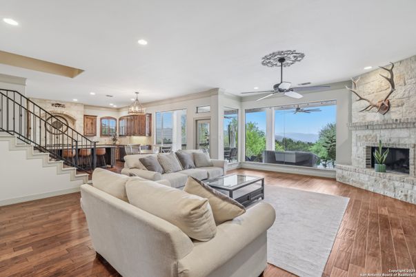 Chandelier, Dining room, Fireplace, Interior, Living room, Recessed Lighting, Stone Walls, Wood Texture Flooring