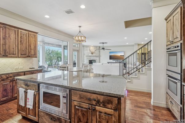 Dining room, Fireplace, Interior, Kitchen, Pendant Lights, Recessed Lighting, Wood Texture Flooring