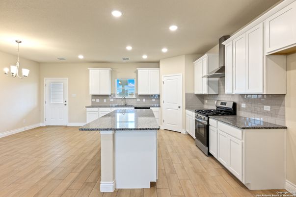Chandelier, Interior, Kitchen, Pendant Lights, Recessed Lighting, Stainless Steel Appliances, Wood Texture Flooring