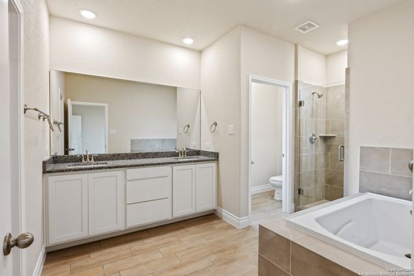 Bathroom, Dual Sink Vanities, Glass Shower, Interior, Recessed Lighting, Wood Texture Flooring