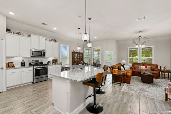 Dining room, Interior, Kitchen, Living room, Pendant Lights, Recessed Lighting, Stainless Steel Appliances, Wood Texture Flooring