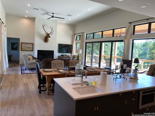 Dining room, Fireplace, Interior, Living room, Recessed Lighting, Wood Texture Flooring