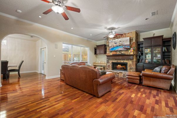 Dining room, Fireplace, Interior, Living room, Recessed Lighting, Wood Texture Flooring