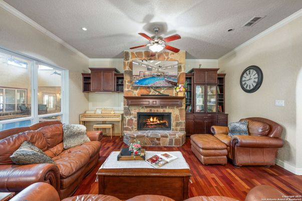 Fireplace, Interior, Living room, Piano, Recessed Lighting, Wood Texture Flooring