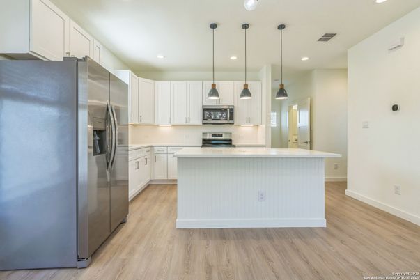 Interior, Kitchen, Pendant Lights, Recessed Lighting, Stainless Steel Appliances, Wood Texture Flooring